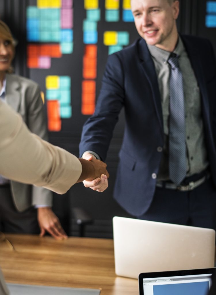 Business people shaking hands in a meeting room