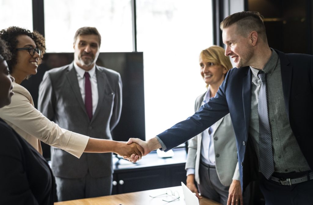 Business people shaking hands in a meeting room